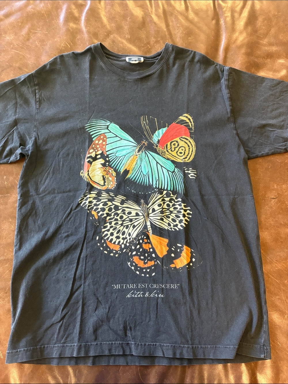 Kith Black Butterfly Graphic Tee with Teal & Orange Accents
